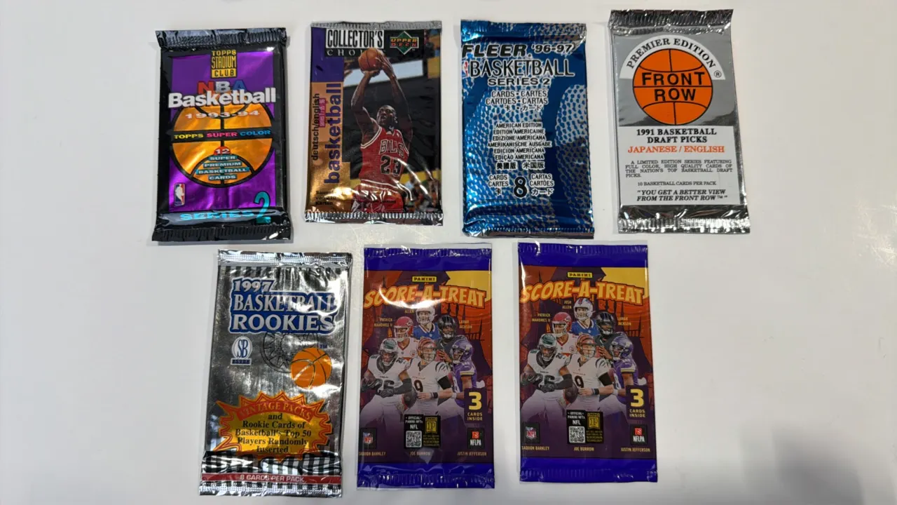 A Collection of Sealed Sports Card Packs. (Various, 1991-2020s) A collection of (7) factory-sealed sports card packs. Includes (5) NBA basketball pack