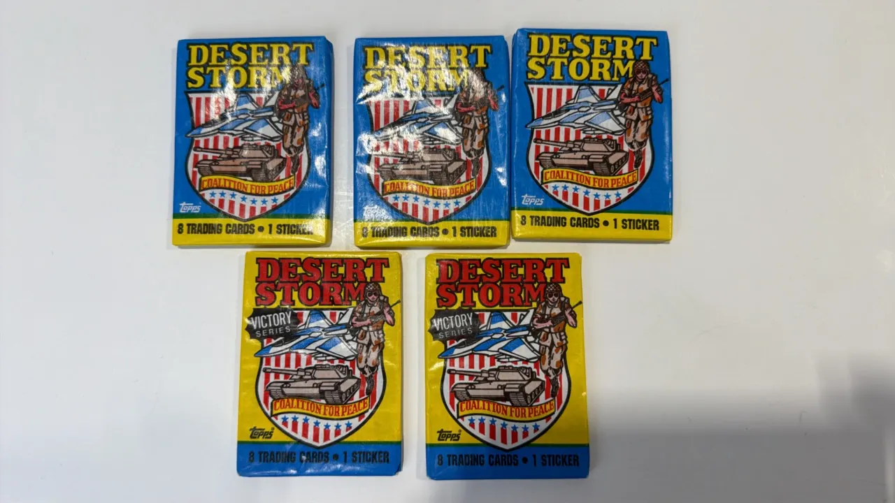 A Collection of 1991 Topps Desert Storm Wax Packs. (Topps, 1991) A collection of (5) factory-sealed Desert Storm trading card packs, including (3) Coa