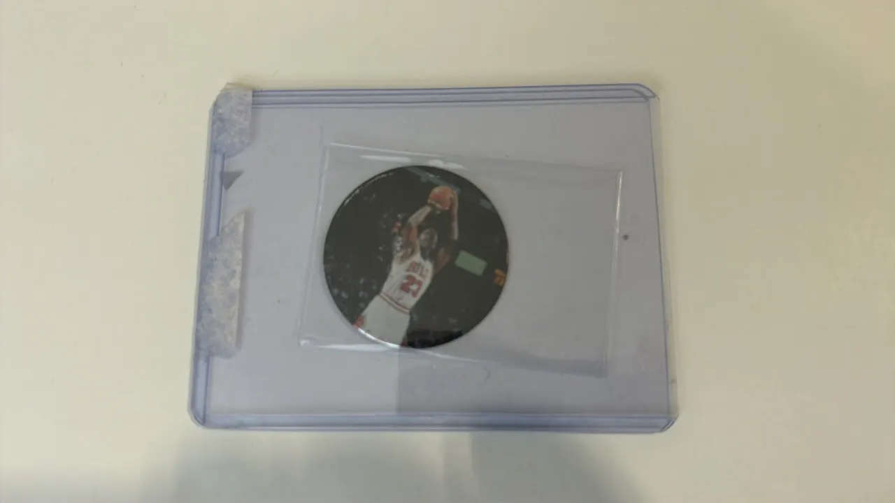 A Michael Jordan Upper Deck Basketball Coin. (Upper Deck, 1996) An Upper Deck basketball coin (No. S34) featuring Michael Jordan of the Chicago Bulls