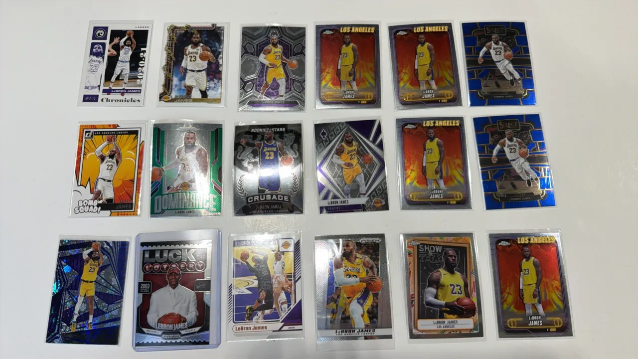 A Collection of (18) LeBron James Trading Cards. (Panini/Topps, 2020-Present) Features cards from Panini Prizm, Mosaic, Select, Chronicles, Donruss, a