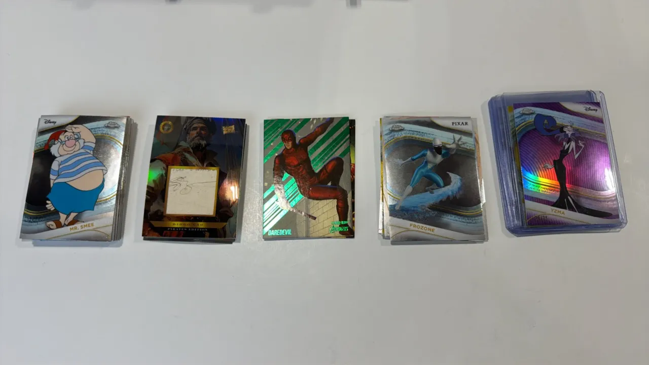 A Collection of Assorted Trading Cards. (Various, 2020s) Includes Disney Chrome, Pixar Chrome, Marvel, and Pirates Edition series. Features refractors
