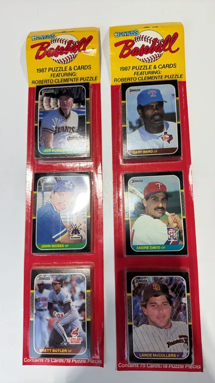 A Pair of 1987 Donruss Baseball Retail Rack Packs. (Leaf, Inc., 1987) Sealed rack packs, each containing 75 cards and 18 Roberto Clemente puzzle piece