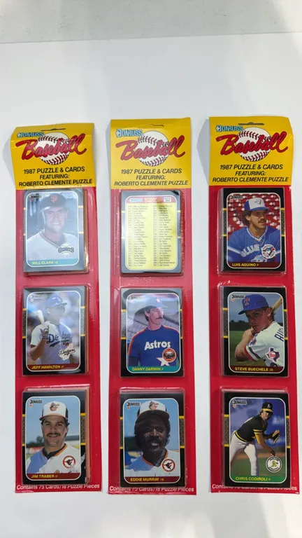 A Collection of 1987 Donruss Baseball Rack Packs. (Leaf, Inc., 1987) Factory sealed rack packs, each containing 75 cards and 18 Roberto Clemente puzzl