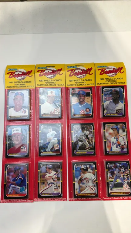 A Collection of 1987 Donruss Baseball Rack Packs. (Donruss, 1987) Four factory-sealed retail rack packs containing 75 cards and 18 Roberto Clemente pu