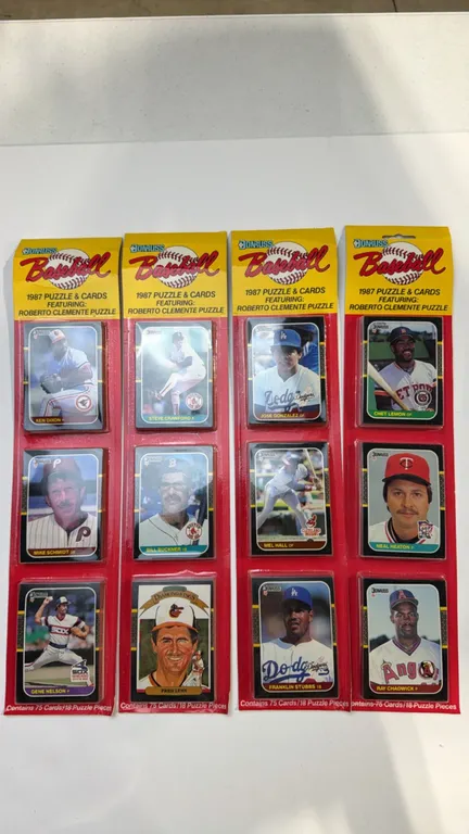 A Set of 1987 Donruss Baseball Sealed Rack Packs. (Donruss, 1987) Four sealed rack packs, each containing 75 cards and 18 Roberto Clemente puzzle piec