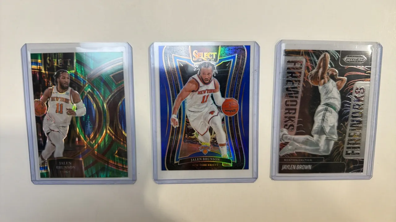 A Collection of (3) Panini NBA Trading Cards. (Panini, 2023-2025) Includes a 2023-24 Select Jalen Brunson #194 Premier Level Green Prizm, 2024-25 Sele