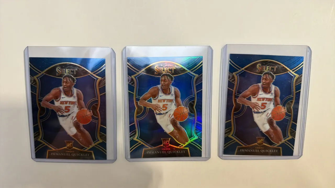 A Collection of (3) Immanuel Quickley Rookie Trading Cards. (Panini, 2020-21) Featuring New York Knicks guard Immanuel Quickley, each Concourse Level