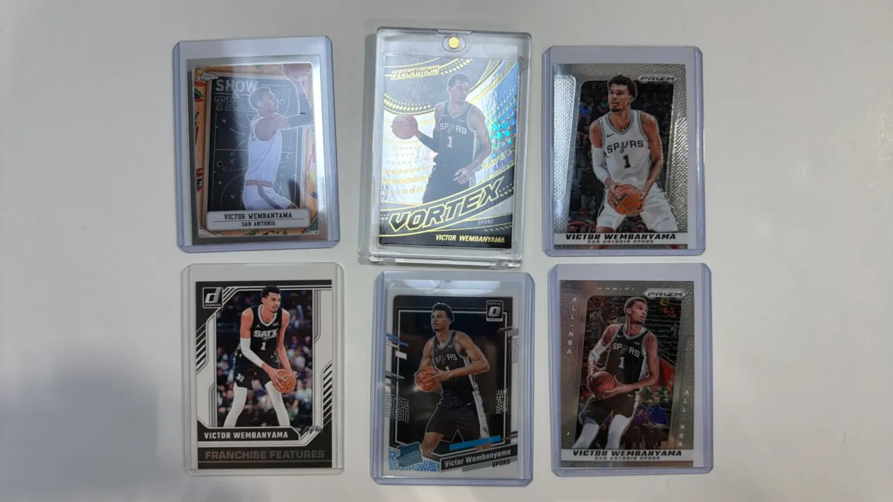A Collection of (6) Victor Wembanyama Trading Cards. (Panini/Topps, 2023-2024) Includes Topps Chrome Show & Tell, Panini Revolution Vortex, (2) Panini
