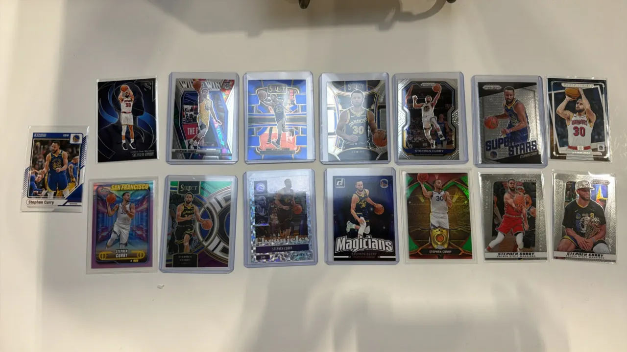 A Collection of Stephen Curry Basketball Cards. (Panini/Topps, Modern) A collection of 15 assorted Stephen Curry cards from Panini Prizm, Select, Mosa