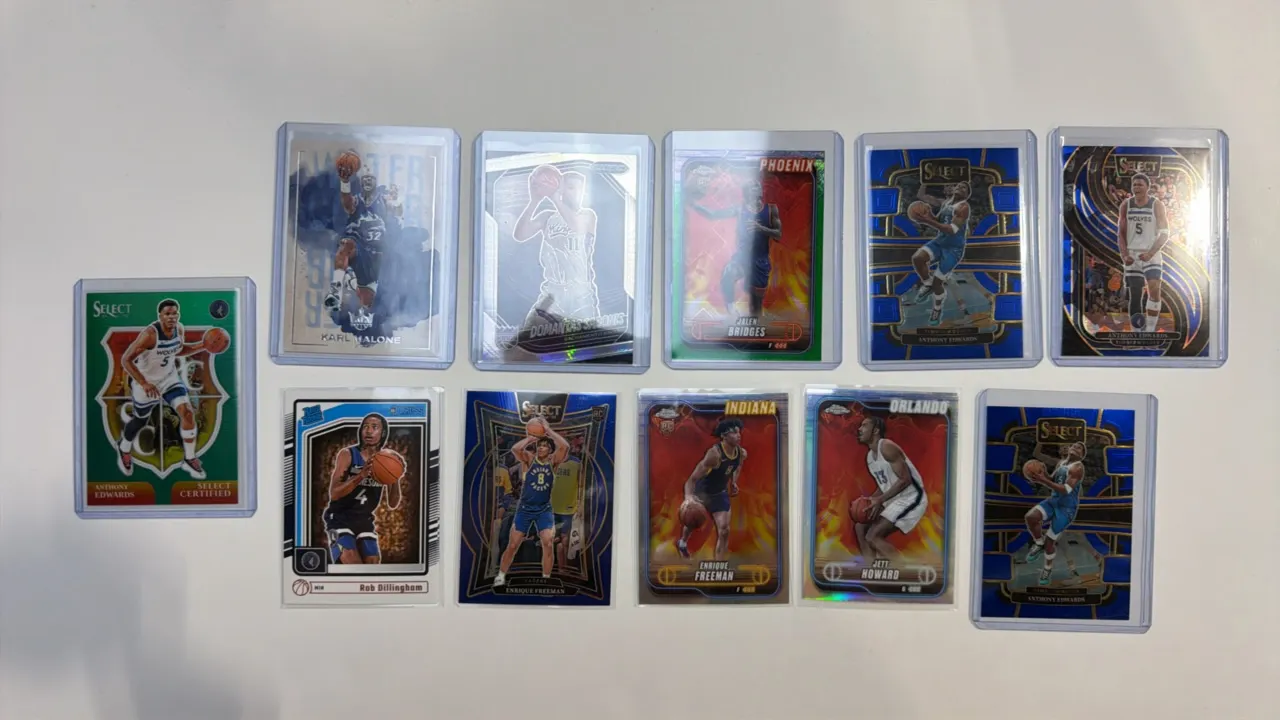 A Collection of (11) Assorted NBA Trading Cards. (Panini/Topps, Modern) An 11-card lot featuring Anthony Edwards, Karl Malone, Rob Dillingham, Domanta