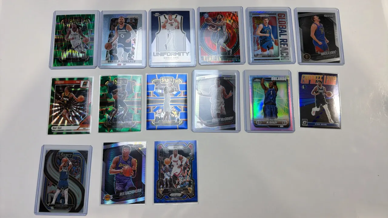 A Collection of (15) Assorted NBA Trading Cards. (Panini/Topps, Modern) A lot of 15 cards from Panini Prizm, Select, Donruss Optic, and Topps Chrome.