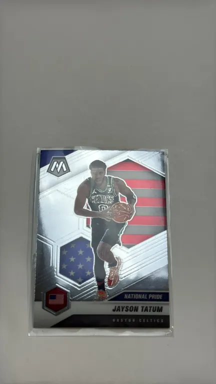 A Jayson Tatum 2020-21 Panini Mosaic "National Pride" Trading Card. (Panini, 2020-21) Featuring the Boston Celtics forward in a USA Basketball-themed