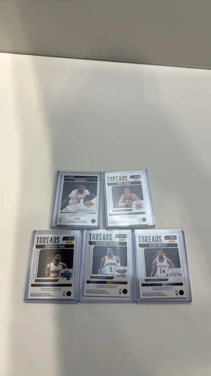 A Collection of 2024-25 Panini Silhouette Basketball Relic Cards. (Panini, 2024-2025) A 5-card lot featuring enclosed game-worn/used material swatches
