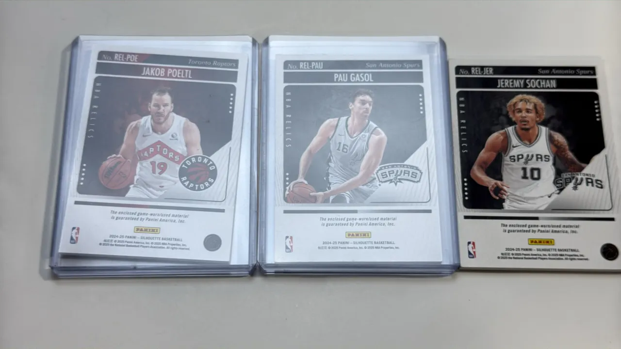 A Collection of Panini Silhouette Basketball Relic Cards. (Panini, 2024-2025) A set of (3) NBA Relics cards featuring enclosed game-worn/used material