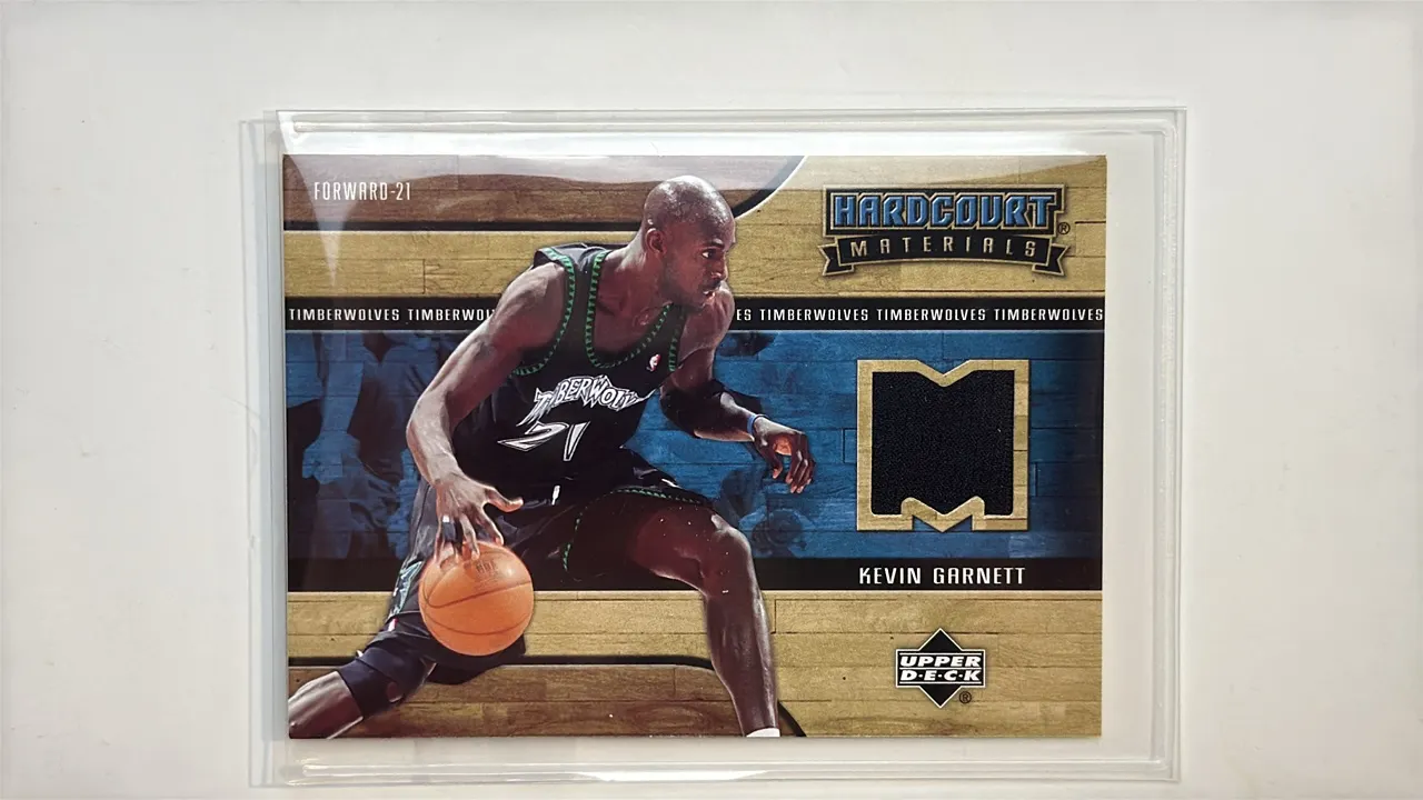 A 2006-07 Upper Deck Kevin Garnett Hardcourt Materials Card. (Upper Deck, 2006-07) A basketball trading card featuring Kevin Garnett #21 of the Minnes