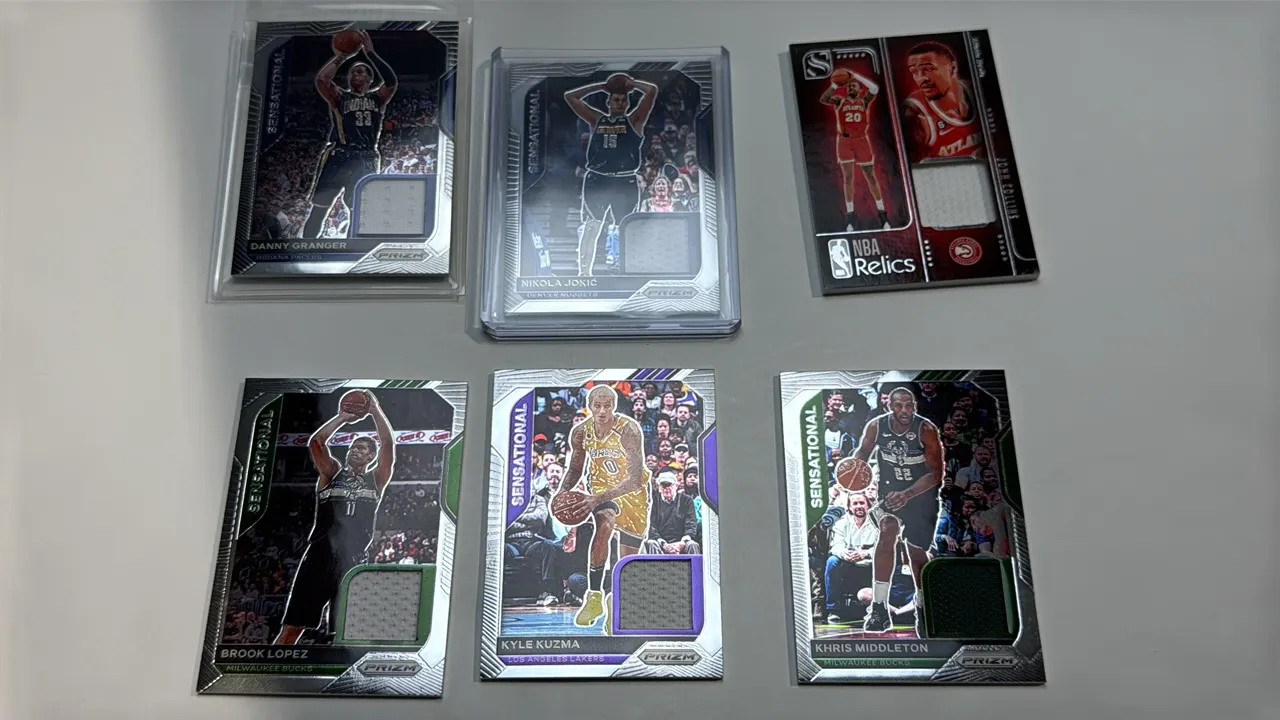 A Collection of Panini NBA Basketball Relic Cards. (Panini, 2020-2025) A lot of (6) NBA relic cards with embedded game-worn or used material swatches.