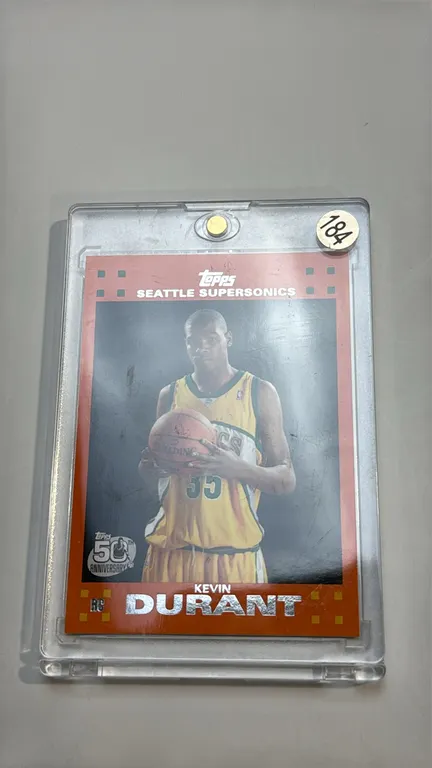 A Kevin Durant Seattle SuperSonics Rookie Card. (Topps, 2007-08) Card #2 of 14 featuring the RC and Topps 50th Anniversary logos. Housed in a magnetic