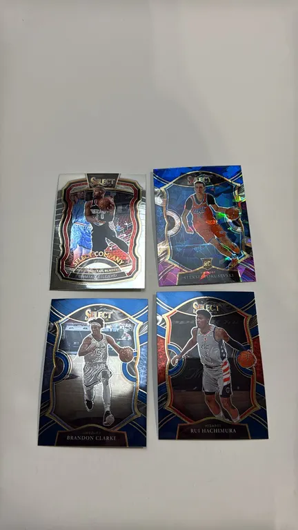 A Set of 2020-21 Panini Select Basketball Cards. (Panini, 2020-21) A lot of (4) Panini Select NBA cards including Damian Lillard Select Company No. 1,