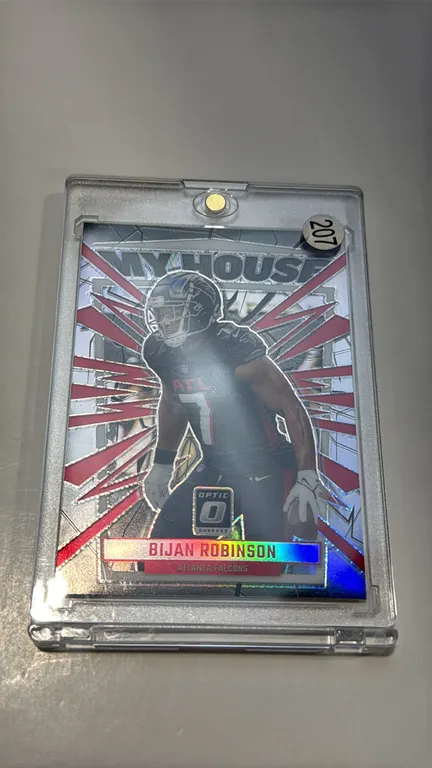 A 2023 Panini Donruss Optic "My House!" Bijan Robinson Trading Card. (Panini, 2023) A "My House!" insert trading card No. 4 featuring Atlanta Falcons
