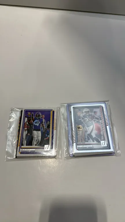 A Collection of Panini Donruss Football Trading Cards. (Panini, 2020s) A lot of mixed football trading cards featuring Jaxson Dart Elite Series, Jorda