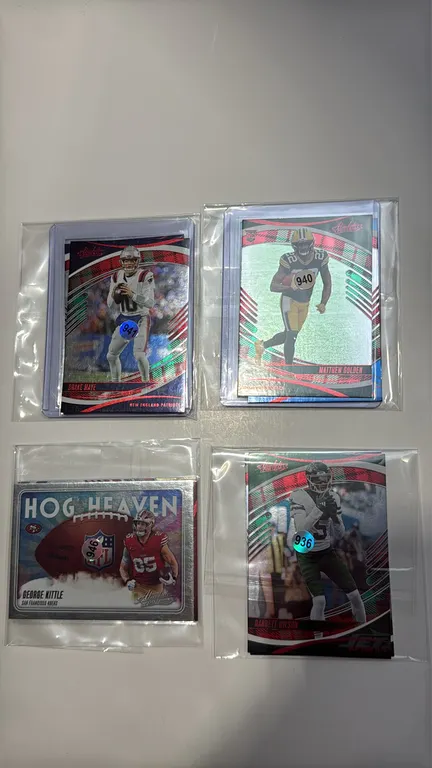 A Collection of 2025 Panini Absolute Football Trading Cards. (Panini, 2025) A 12-card assortment across 4 sets featuring stars and rookies such as Dra