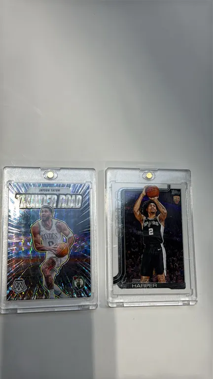 A Pair of Basketball Trading Cards. (Panini / Topps, 2024-2025) Includes a 2024-25 Panini Mosaic Jayson Tatum "Thunder Road" insert (No. 6) and a 2025