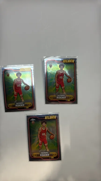 A Set of (3) 2025 Topps Chrome Zaccharie Risacher Rookie Cards #169. (Topps, 2025) Atlanta Hawks rookie basketball cards featuring the RC shield and F
