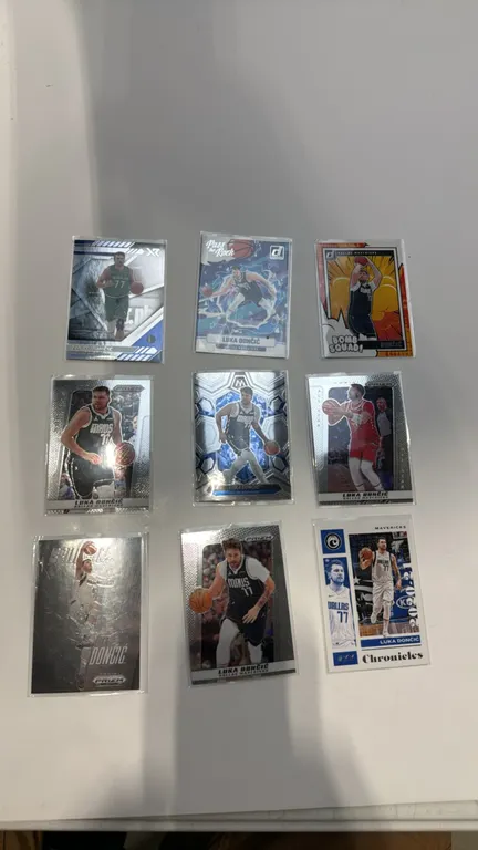 A Collection of (9) Luka Dončić Basketball Cards. (Panini, 2020-2025) A collection of (9) trading cards featuring Dallas Mavericks star Luka Dončić. I