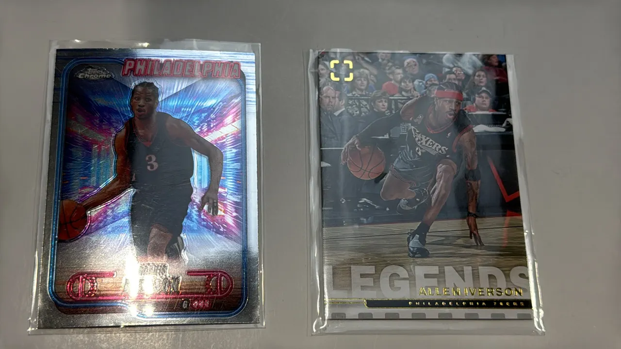 An Allen Iverson Basketball Trading Card Lot. (Topps / Panini, 2024-2025) A pair of trading cards featuring Allen Iverson with the Philadelphia 76ers,