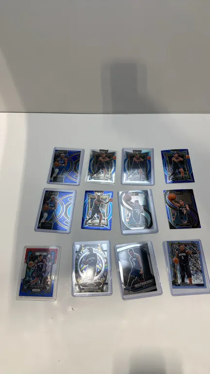 A Collection of (12) Paolo Banchero Basketball Cards. (Panini, 2023-2024) A 12-card lot featuring Orlando Magic star Paolo Banchero across Panini Sele