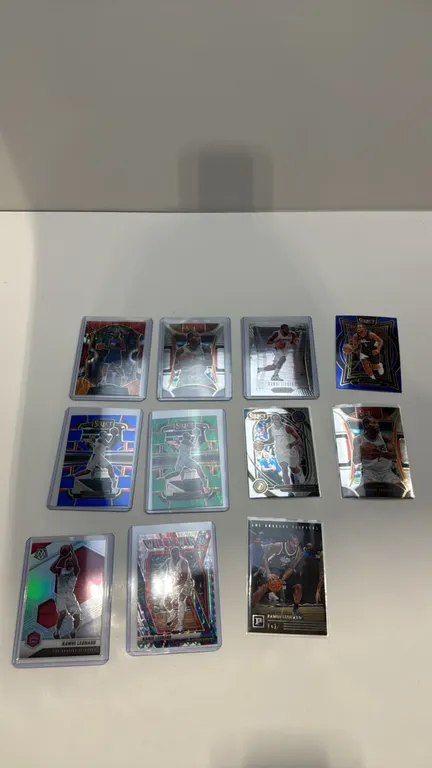 A Collection of (11) Kawhi Leonard Basketball Cards. (Panini, 2020-2024) A collection of 11 assorted trading cards spanning 2020 to 2024. Includes Sel