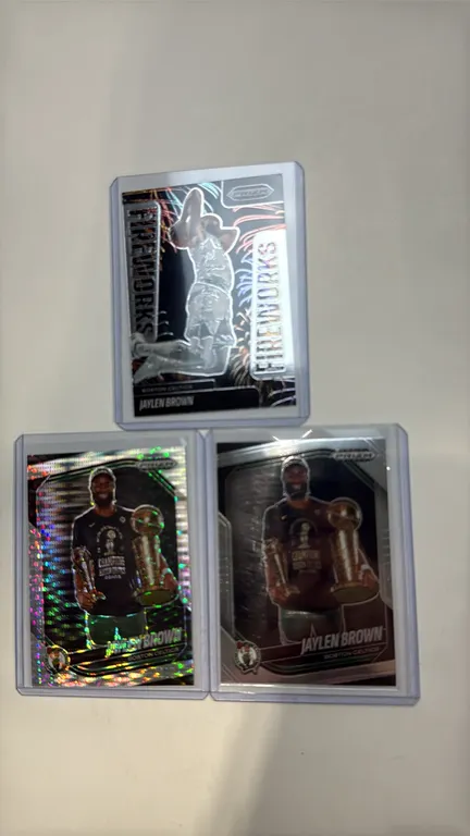 A Collection of Jaylen Brown Basketball Cards. (Panini, 2024-25) A 3-card lot from the Prizm Black series featuring Boston Celtics star Jaylen Brown.