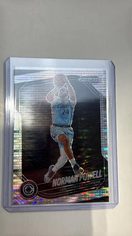 A 2024-25 Panini Prizm Black Norman Powell Basketball Card. (Panini, 2024-25) Card No. 55 featuring Norman Powell of the Los Angeles Clippers with a h