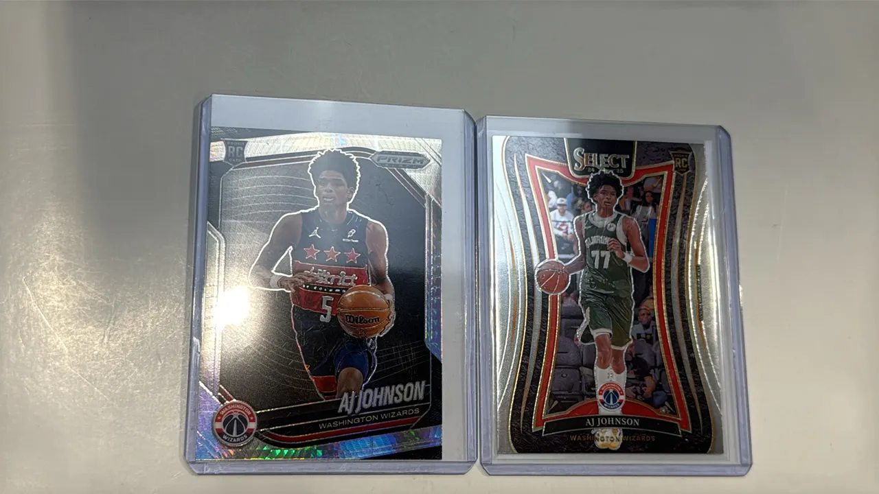 A Pair of AJ Johnson Rookie Basketball Cards. (Panini, 2024-25) Includes (1) Panini Prizm Black card No. 209 and (1) Panini Select Mezzanine Level car
