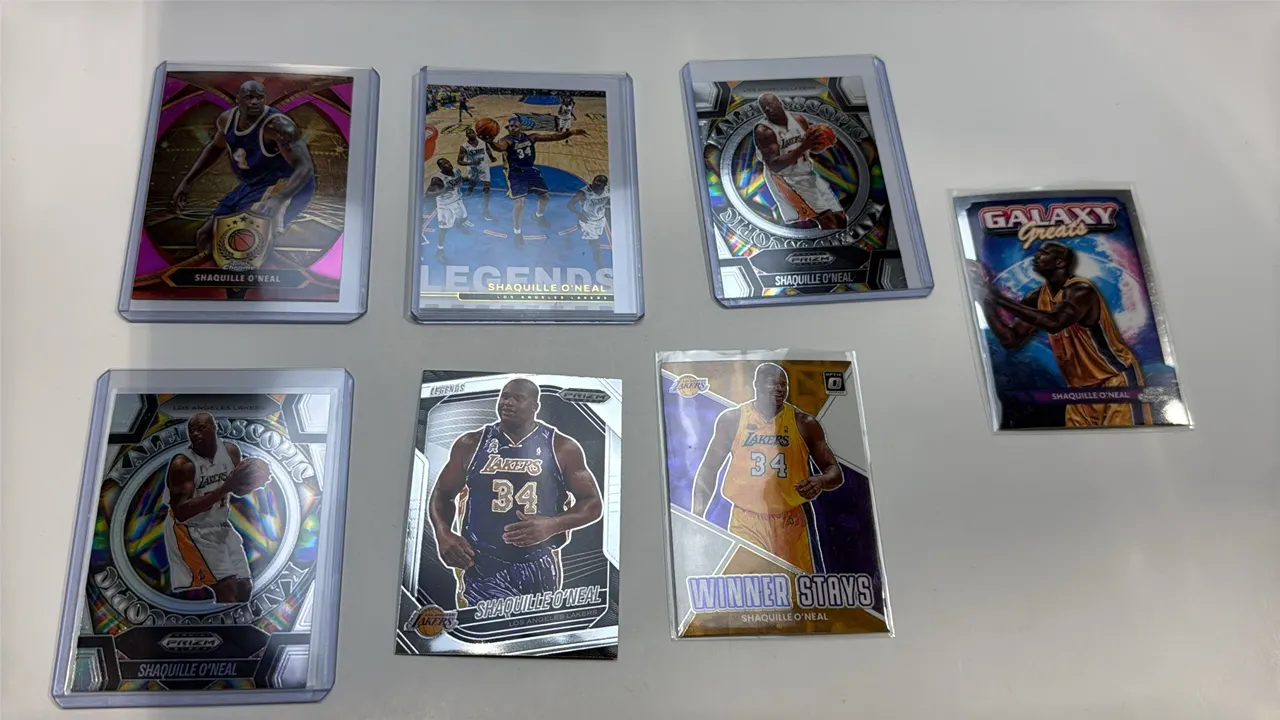 A Collection of (7) Shaquille O'Neal Basketball Cards. (Panini/Topps, 2022-2025) Includes 2022-23 Donruss Optic No. 11, (2) 2024-25 Prizm Black No. 27