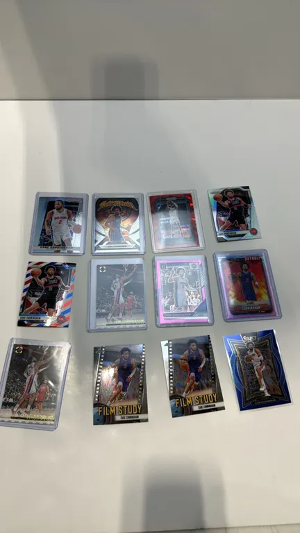 A Collection of (12) Cade Cunningham Basketball Cards. (Panini/Topps, 2020s) A 12-card lot featuring Panini Prizm, Donruss Optic, Select, and Topps Ch