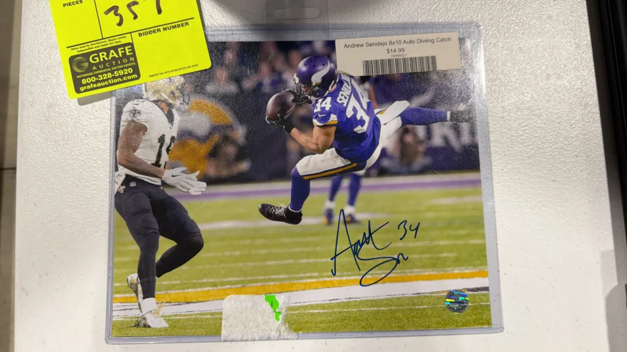 An Andrew Sendejo Autographed Photograph. (Pristine Authentic) An 8" x 10" color photo depicting Andrew Sendejo making a diving catch for the Minnesot