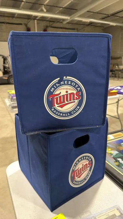 Minnesota Twins foldable fabric cube storage totes. Features navy blue construction with dual handle cutouts and screen-printed team logo. 12"L x 12"W