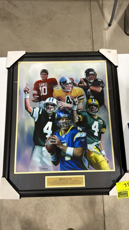 A Brett Favre Framed Sports Art Montage. (Jiang Zunzhong) Features a career tribute montage of Favre in high school, Southern Miss, Falcons, Packers,