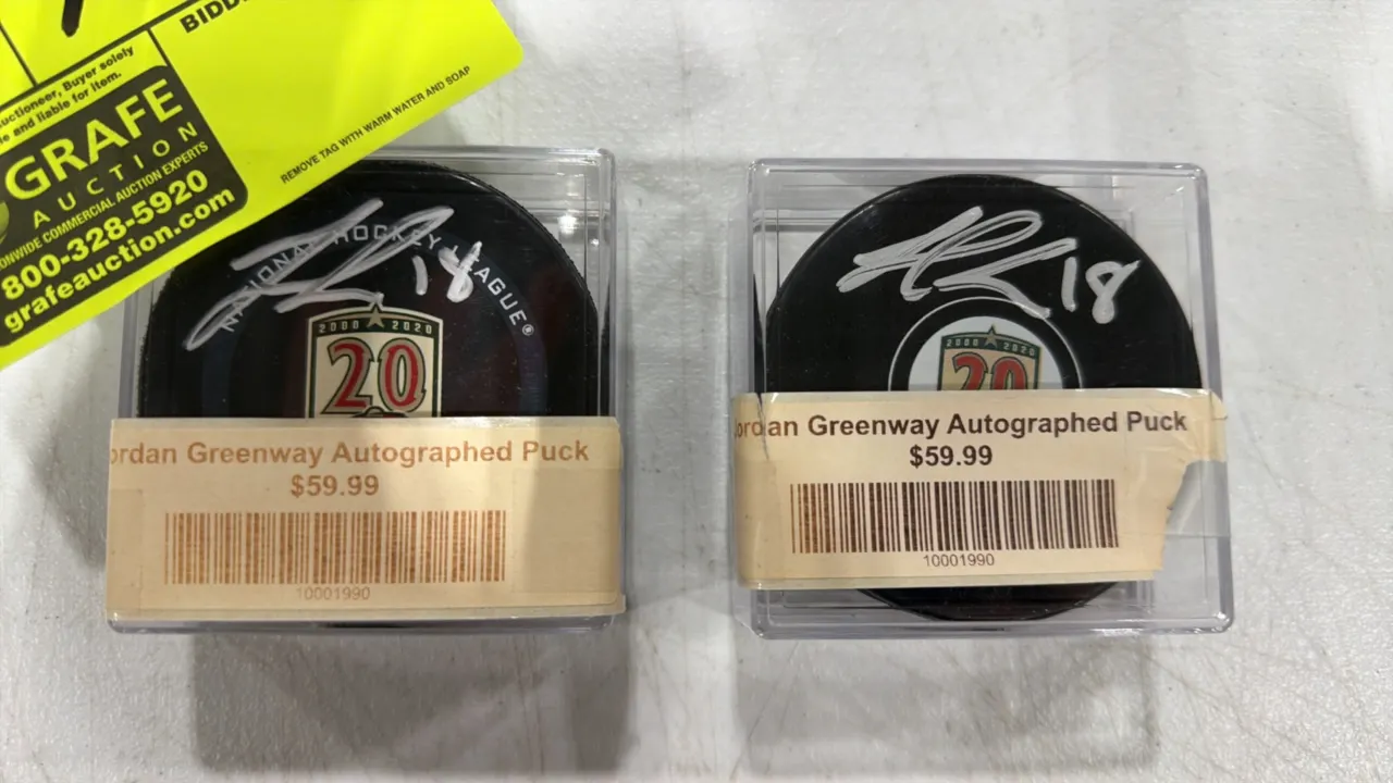 A Pair of Jordan Greenway Autographed Minnesota Wild Hockey Pucks. (NHL, 2020) Official Minnesota Wild 20th Anniversary (2000-2020) pucks, each hand-s