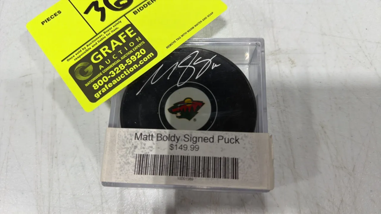 A Matt Boldy Autographed Minnesota Wild Hockey Puck. (Fanatics/NHL) An official licensed NHL hockey puck signed by Matt Boldy in silver ink, featuring