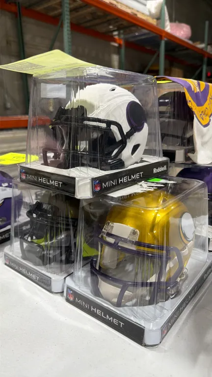 A Set of Minnesota Vikings Riddell Mini Helmets. (Riddell) A collection of three NFL mini replica football helmets including a matte white edition, me