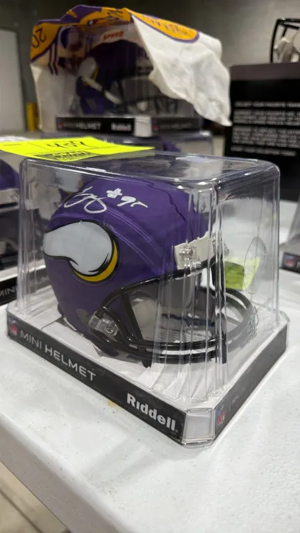 A Minnesota Vikings Ifeadi Odenigbo Signed Mini Helmet. (Riddell) An official NFL licensed mini helmet hand-signed by Ifeadi Odenigbo in silver-tone i