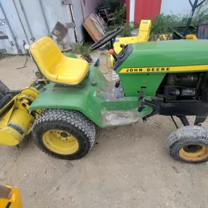 John Deere 300 Lawn and Garden Tractor with Tiller, Mower, and Snow Blower