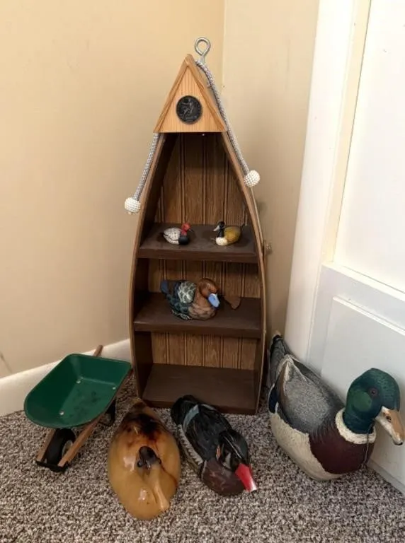 Decorative ducks, decorative wheelbarrow, and
