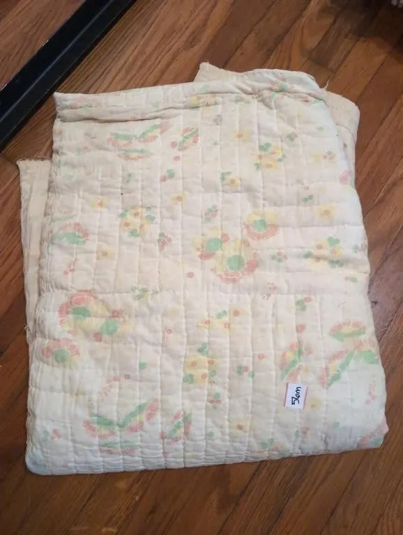 Well worn hand stitched quilt