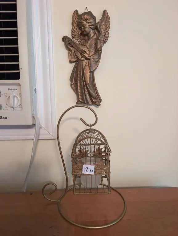Plaster angel and birdcage