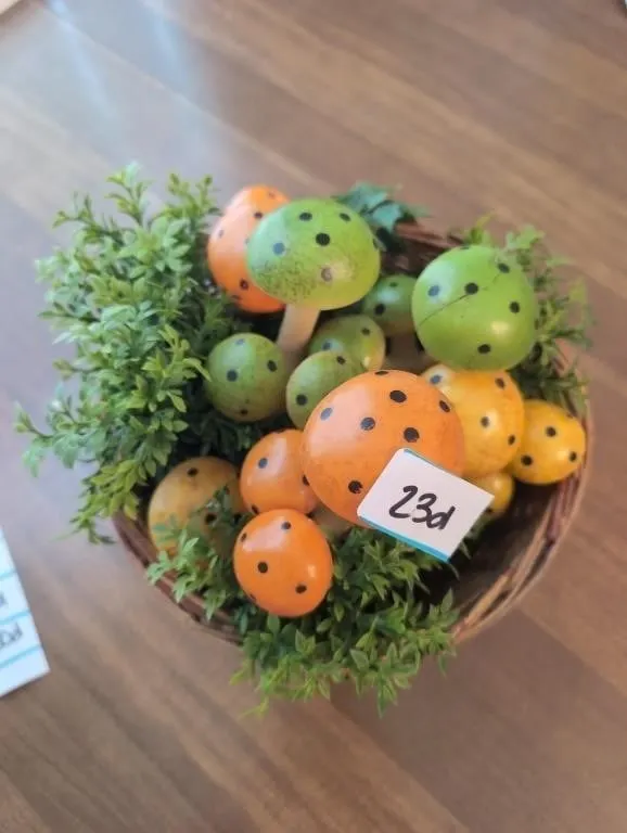 Basket of vintage plastic mushrooms and greenery