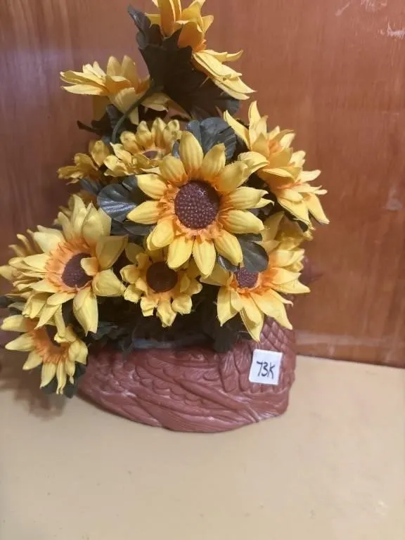 Sunflower floral arrangement in bird planter