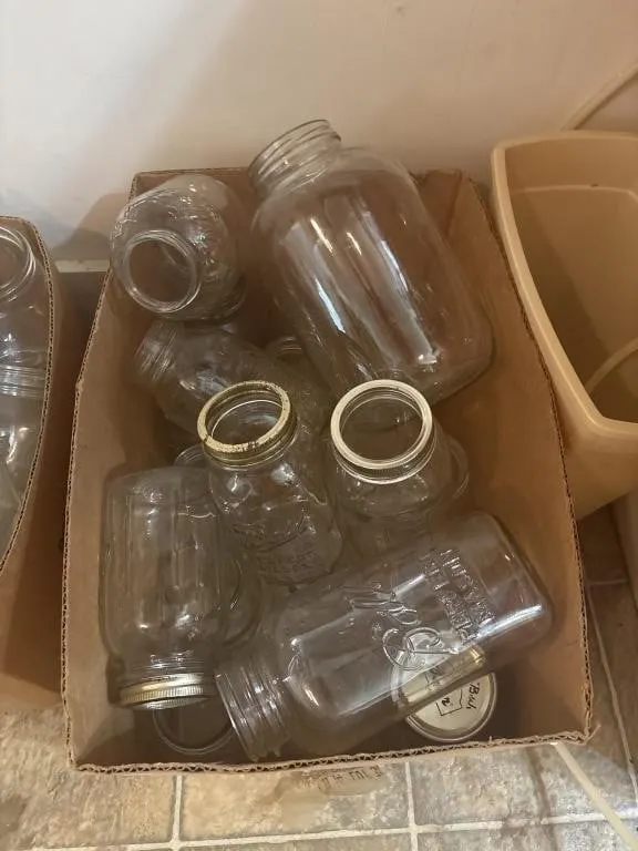 Cardboard box of large canning jars